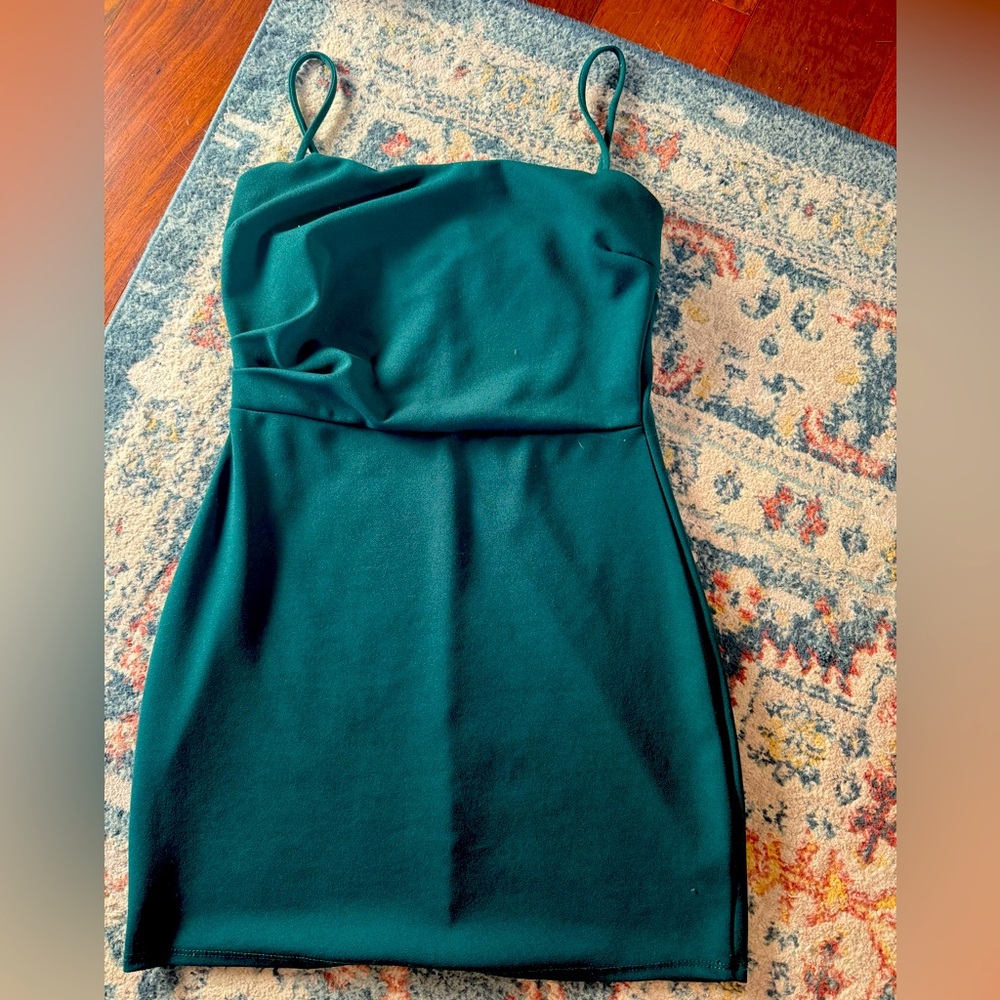Im selling a dark green mini dress. It is a very comfortable and stretchy dress.